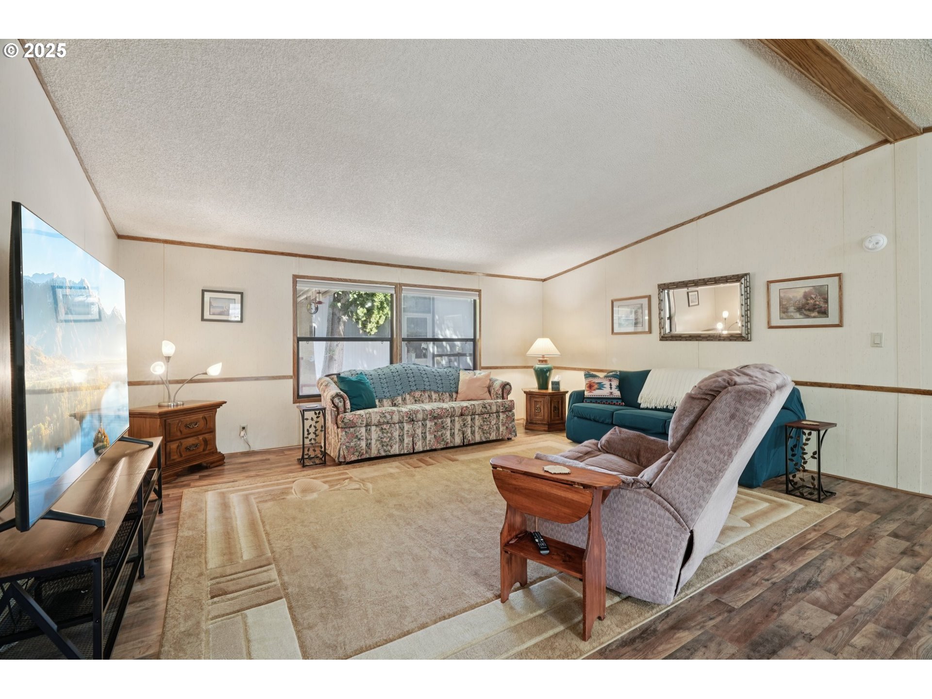 8434 Heritage Court, Unit 19 Clackamas, OR 97015 - Photo 4 of 28 a living room with furniture and a wooden floor