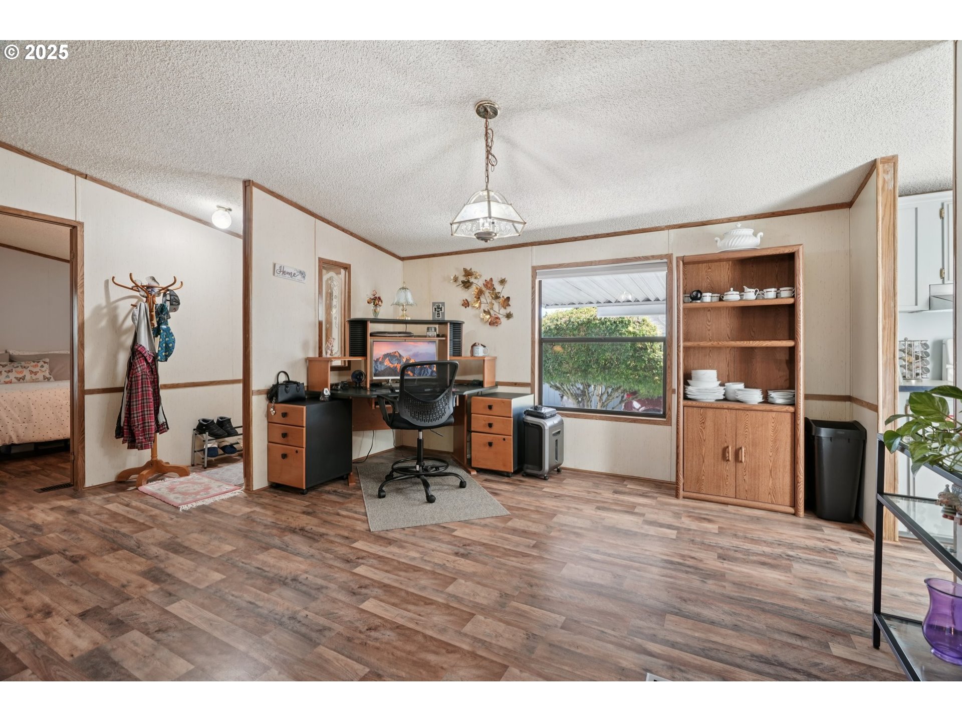 8434 Heritage Court, Unit 19 Clackamas, OR 97015 - Photo 7 of 28 a living room with furniture a window and appliances