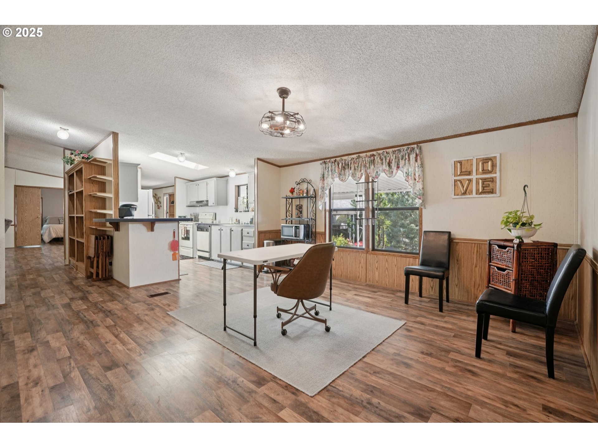 8434 Heritage Court, Unit 19 Clackamas, OR 97015 - Photo 10 of 28 a living room with furniture and a kitchen view