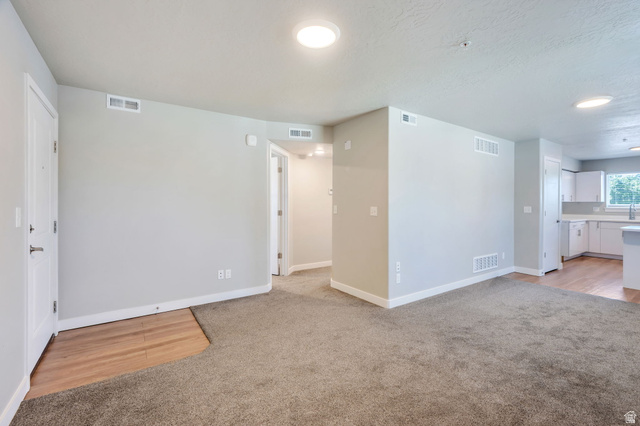 572 South 100 West, Unit E210 Springville, UT 84663 - Photo 11 of 35 Open living area with grey-toned walls and recessed lighting