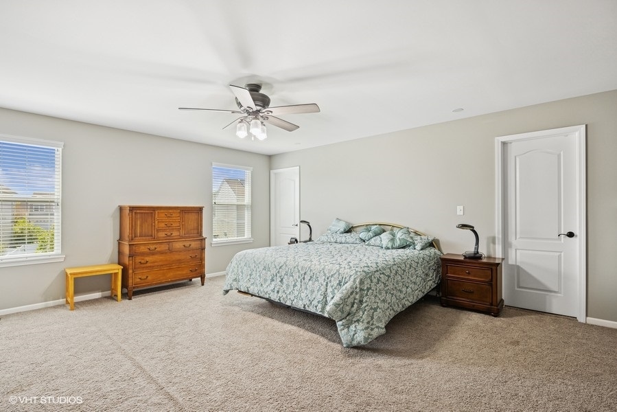 1683 Rockefeller Drive Mundelein, IL 60060 - Photo 13 of 25 a bedroom with a bed and dresser