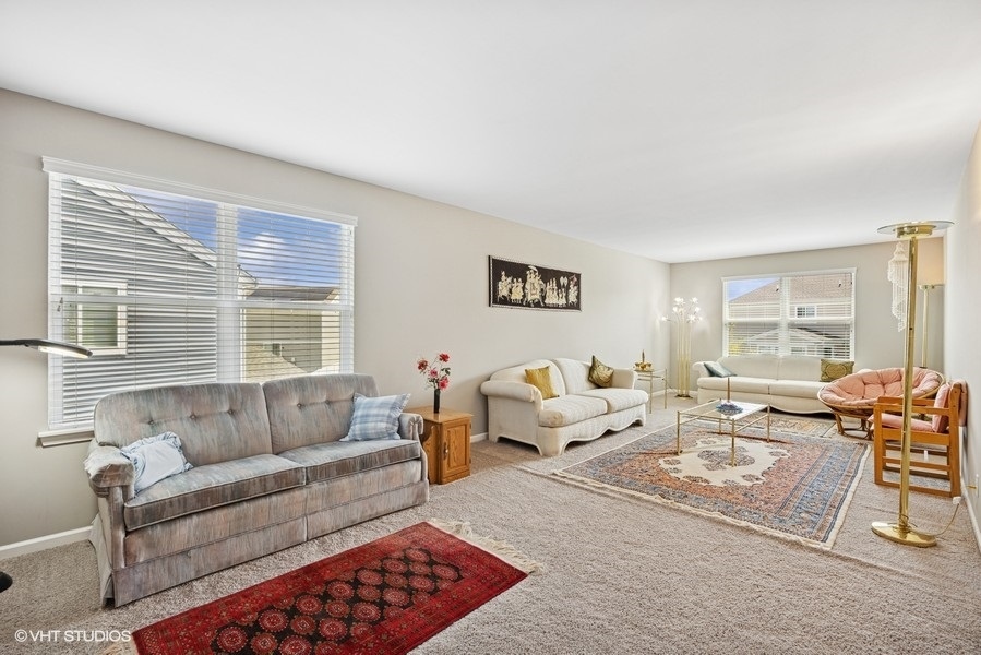 1683 Rockefeller Drive Mundelein, IL 60060 - Photo 15 of 25 a living room with furniture and a large window