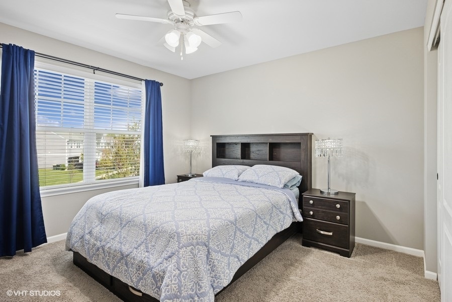 1683 Rockefeller Drive Mundelein, IL 60060 - Photo 16 of 25 a bedroom with a bed and a tv