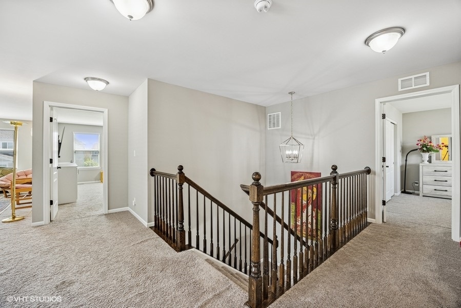 1683 Rockefeller Drive Mundelein, IL 60060 - Photo 19 of 25 a view of a hallway with bedroom and entryway