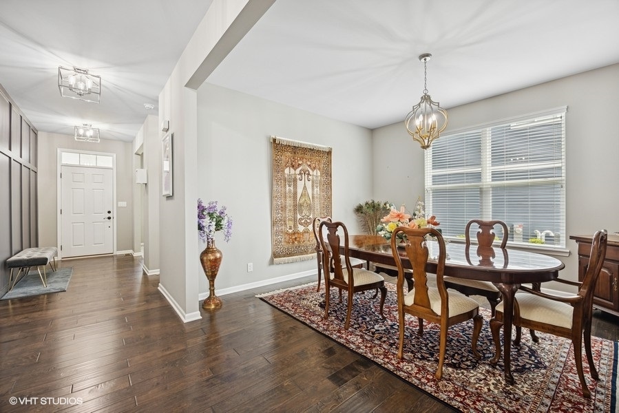 1683 Rockefeller Drive Mundelein, IL 60060 - Photo 5 of 25 a view of a dining room with furniture window and wooden floor