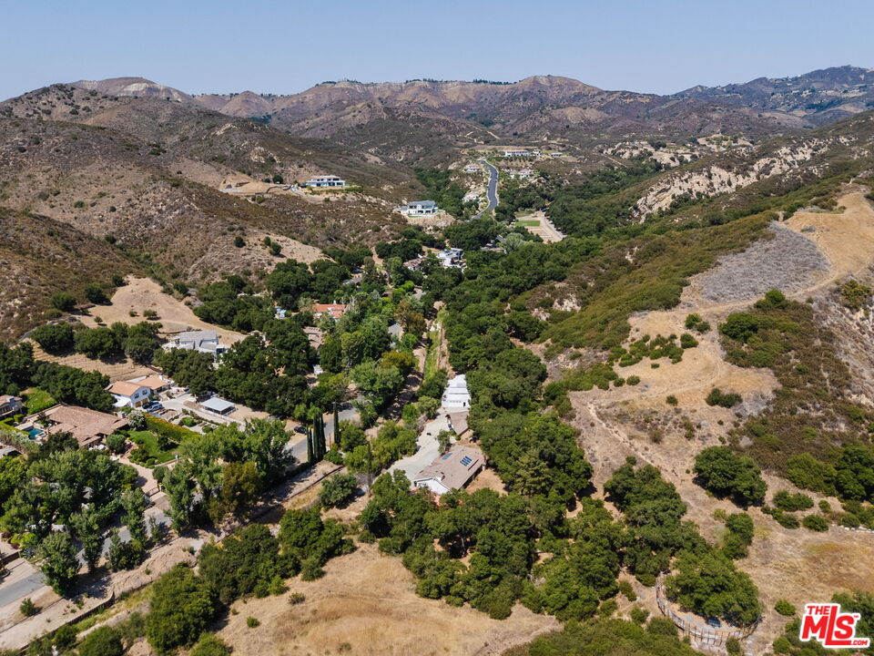 2470 Stokes Canyon Road Calabasas, CA 91302 - Photo 3 of 5 a view of a city with mountains in the background