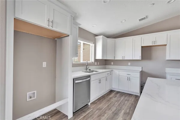 a kitchen with sink cabinets and window