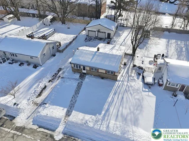 a view of a patio with a table and chairs