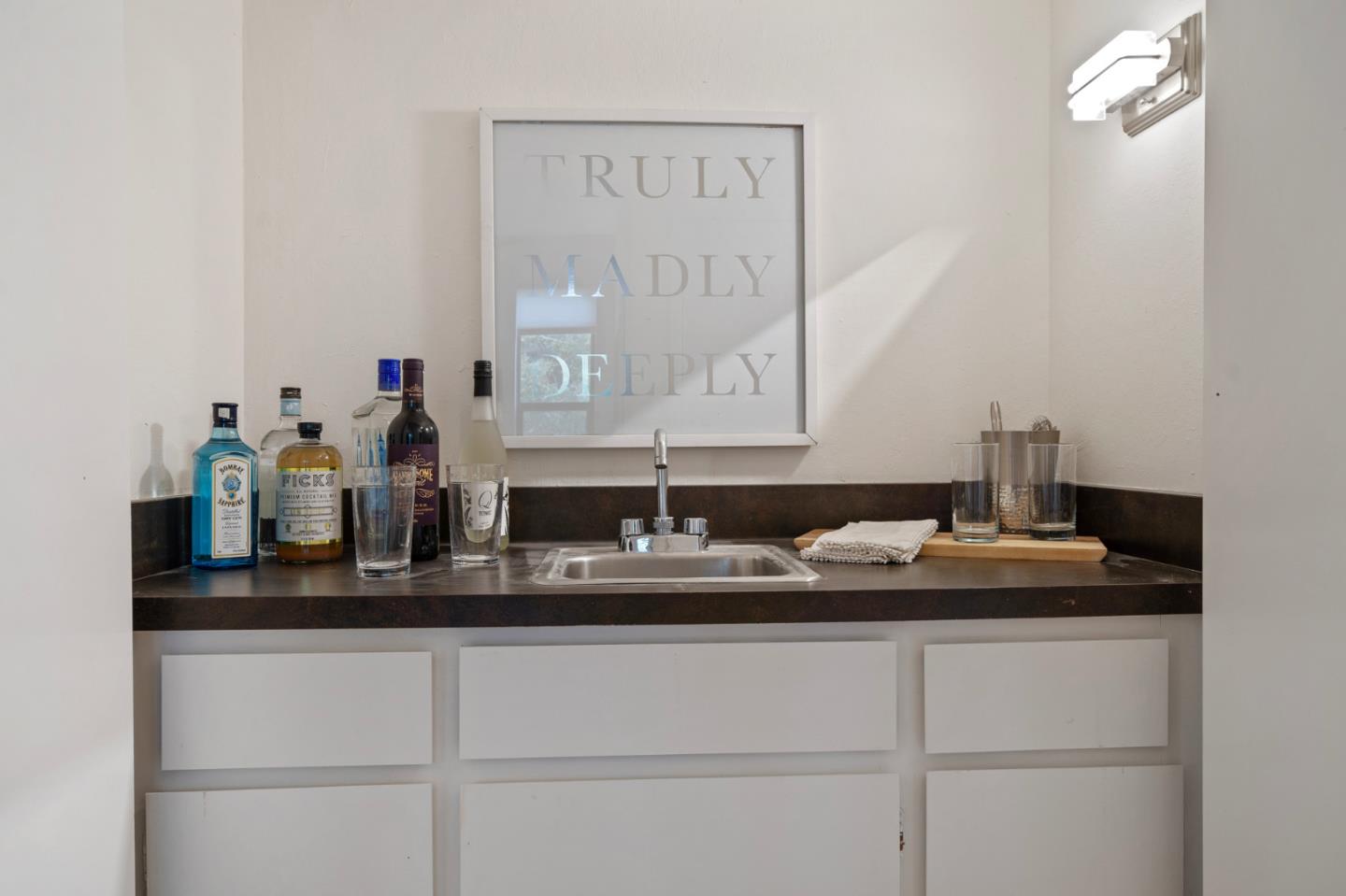525 Almer Road, Unit 210 Burlingame, CA 94010 - Photo 11 of 36 a bathroom with a sink and a mirror