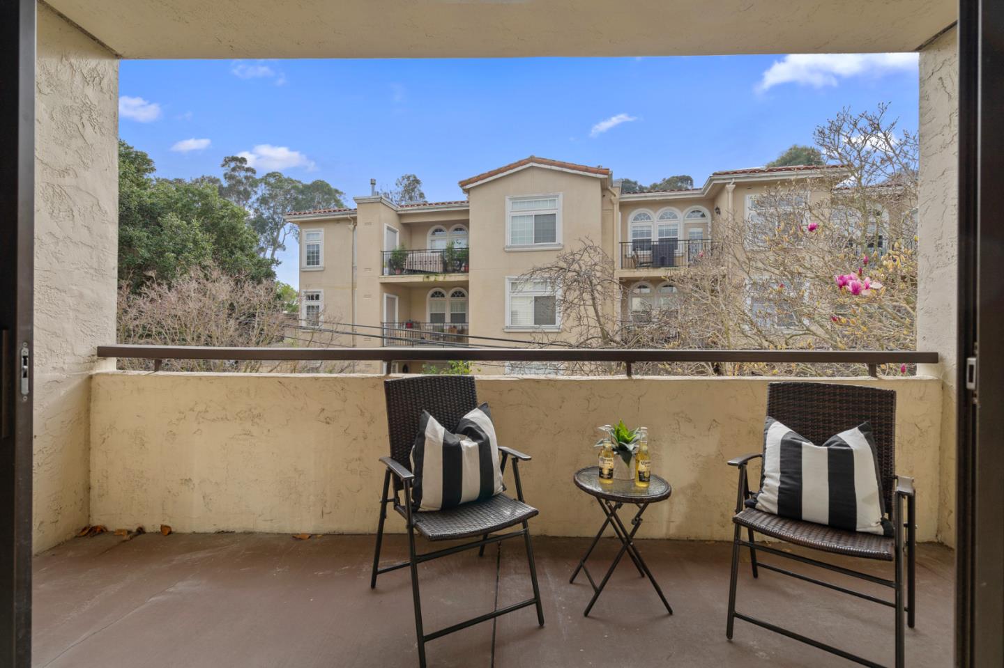 525 Almer Road, Unit 210 Burlingame, CA 94010 - Photo 12 of 36 a view of a balcony with chairs