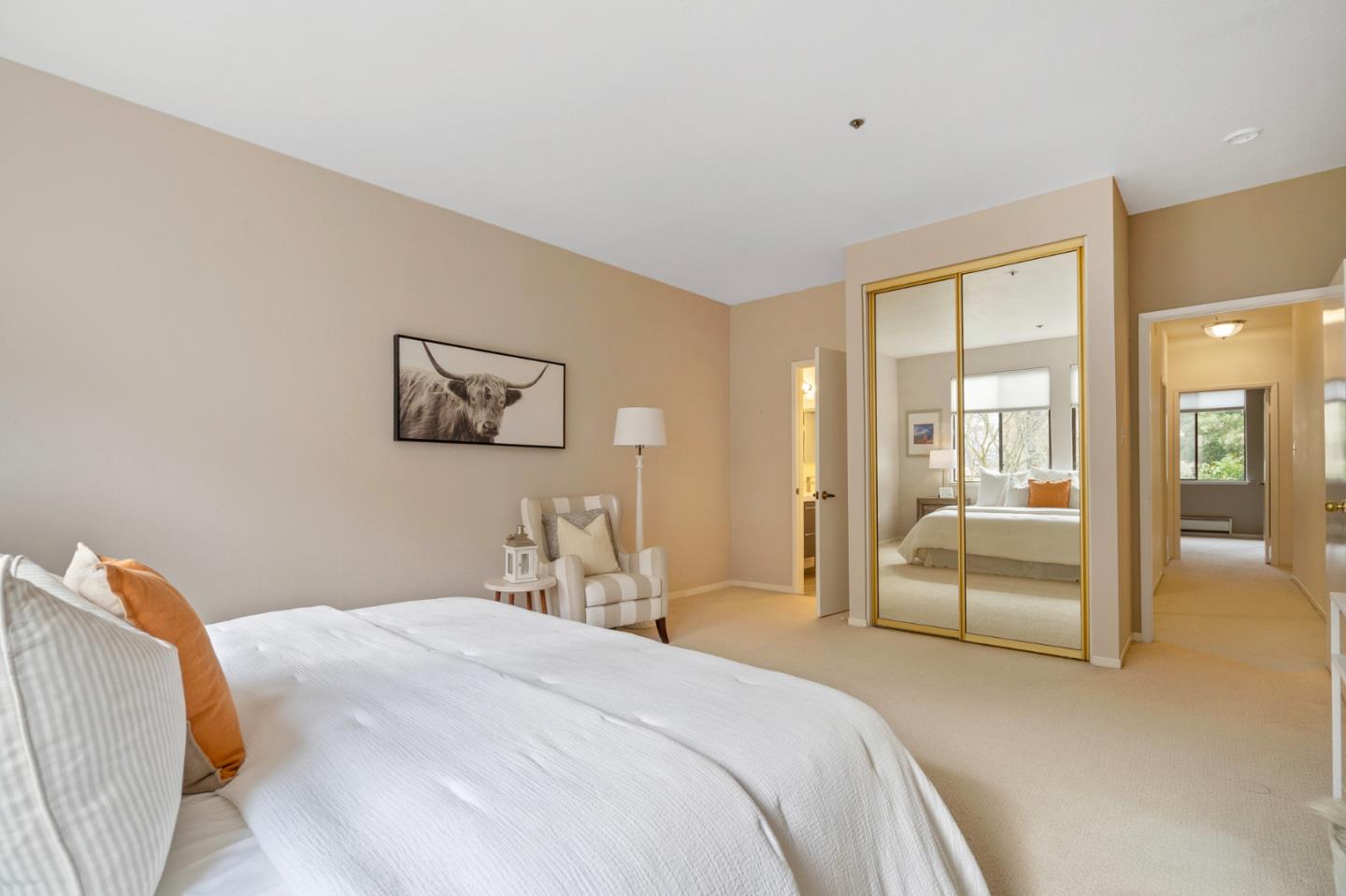 525 Almer Road, Unit 210 Burlingame, CA 94010 - Photo 16 of 36 a bedroom with a large bed and a chandelier