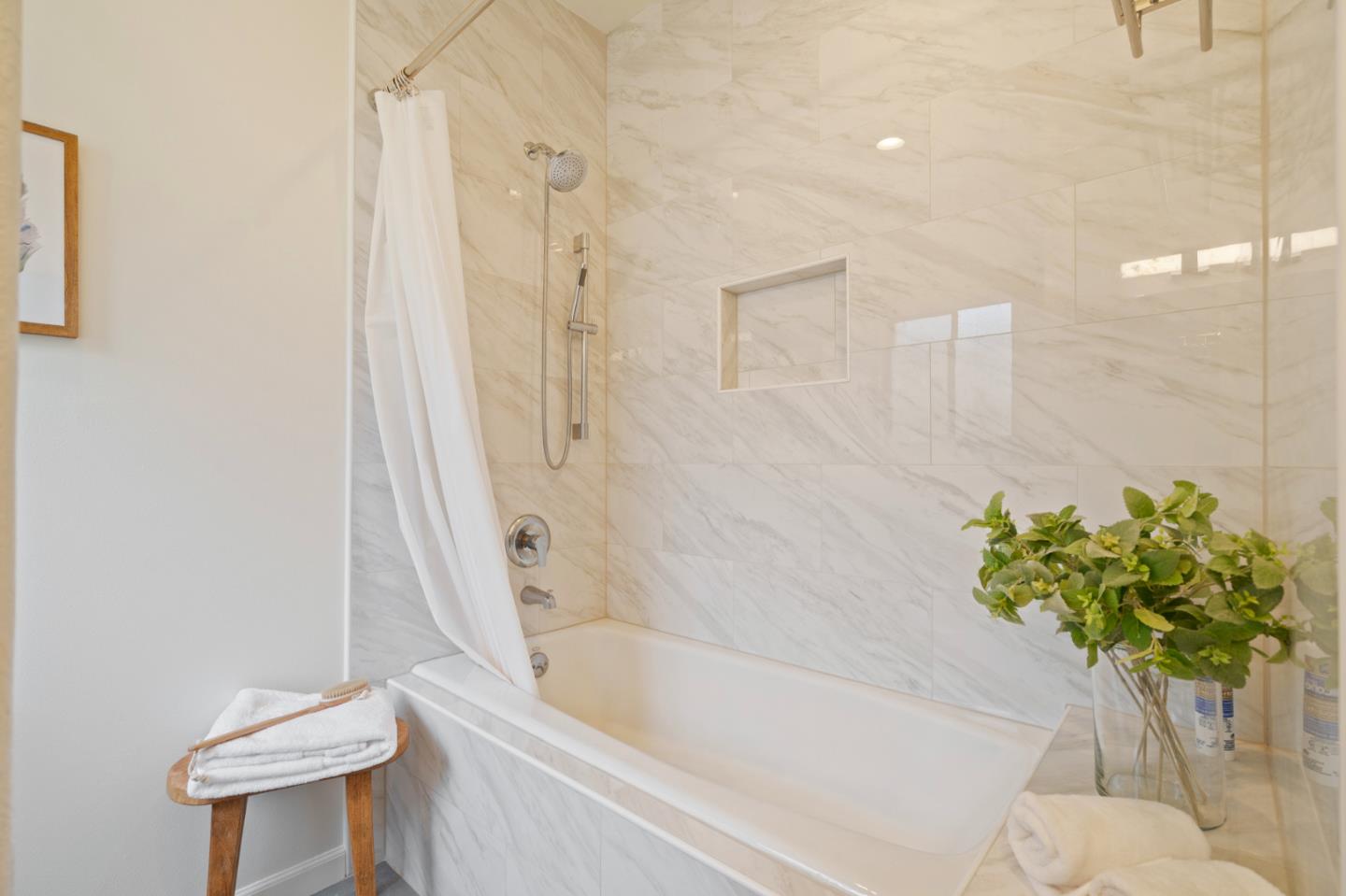 525 Almer Road, Unit 210 Burlingame, CA 94010 - Photo 19 of 36 a bath tub sitting next to a white toilet