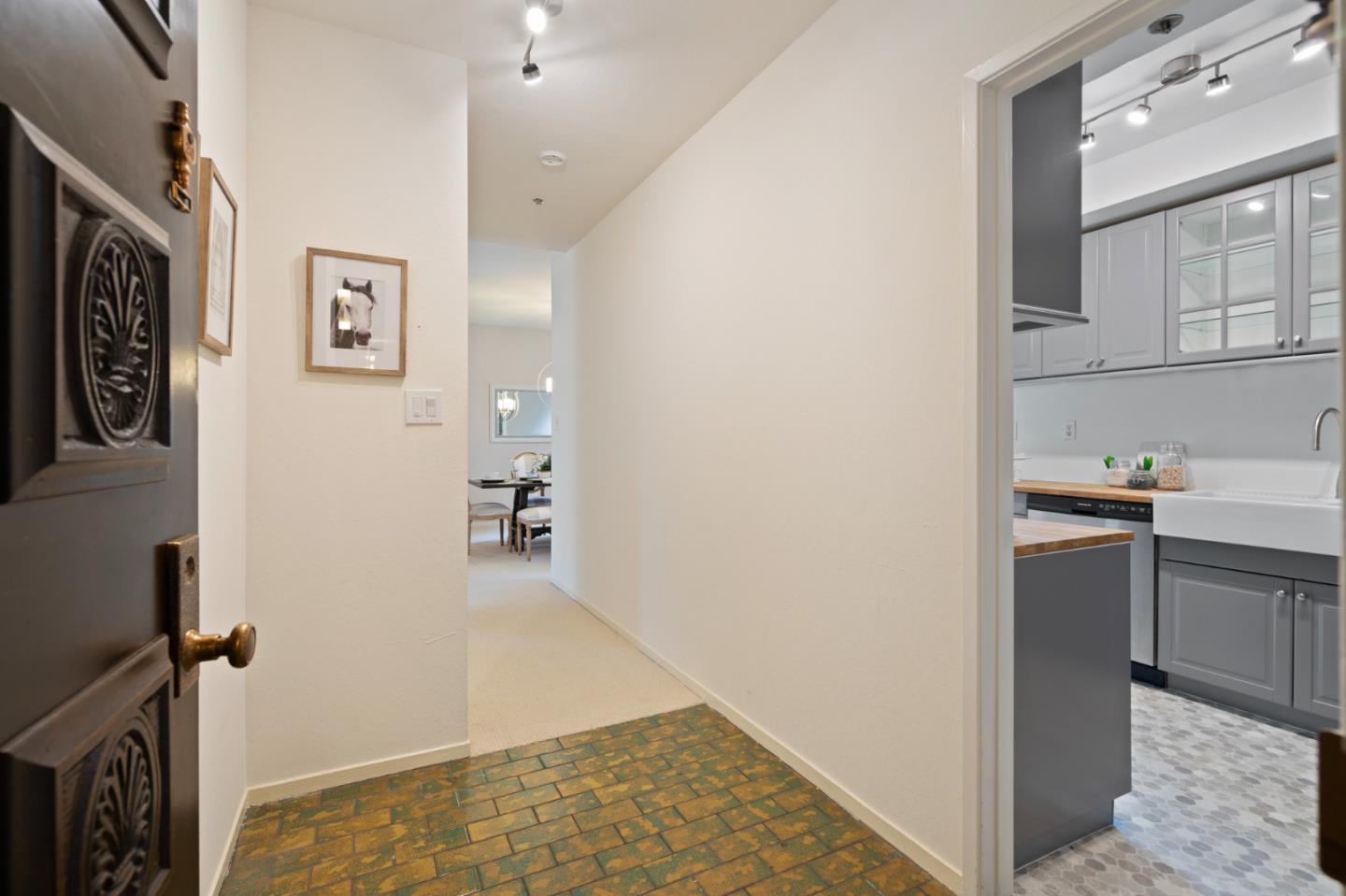 525 Almer Road, Unit 210 Burlingame, CA 94010 - Photo 2 of 36 a view of a kitchen from the hallway