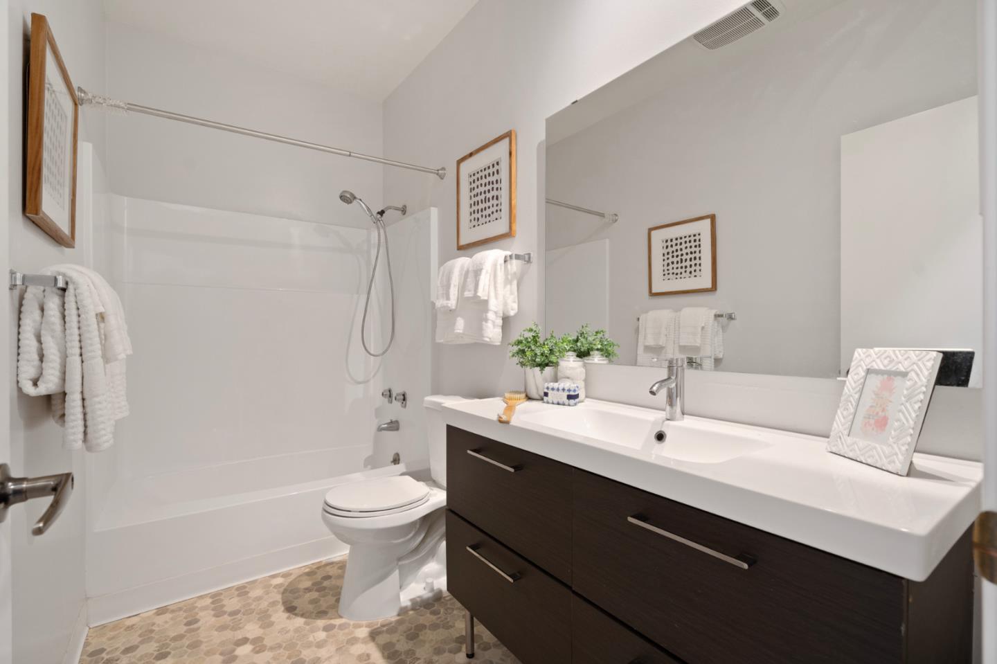 525 Almer Road, Unit 210 Burlingame, CA 94010 - Photo 23 of 36 a bathroom with a sink a toilet and shower