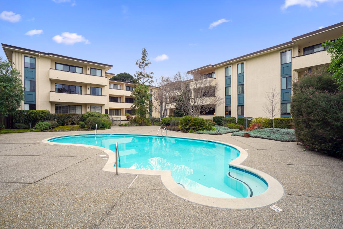 525 Almer Road, Unit 210 Burlingame, CA 94010 - Photo 24 of 36 a view of a house with swimming pool and next to a yard