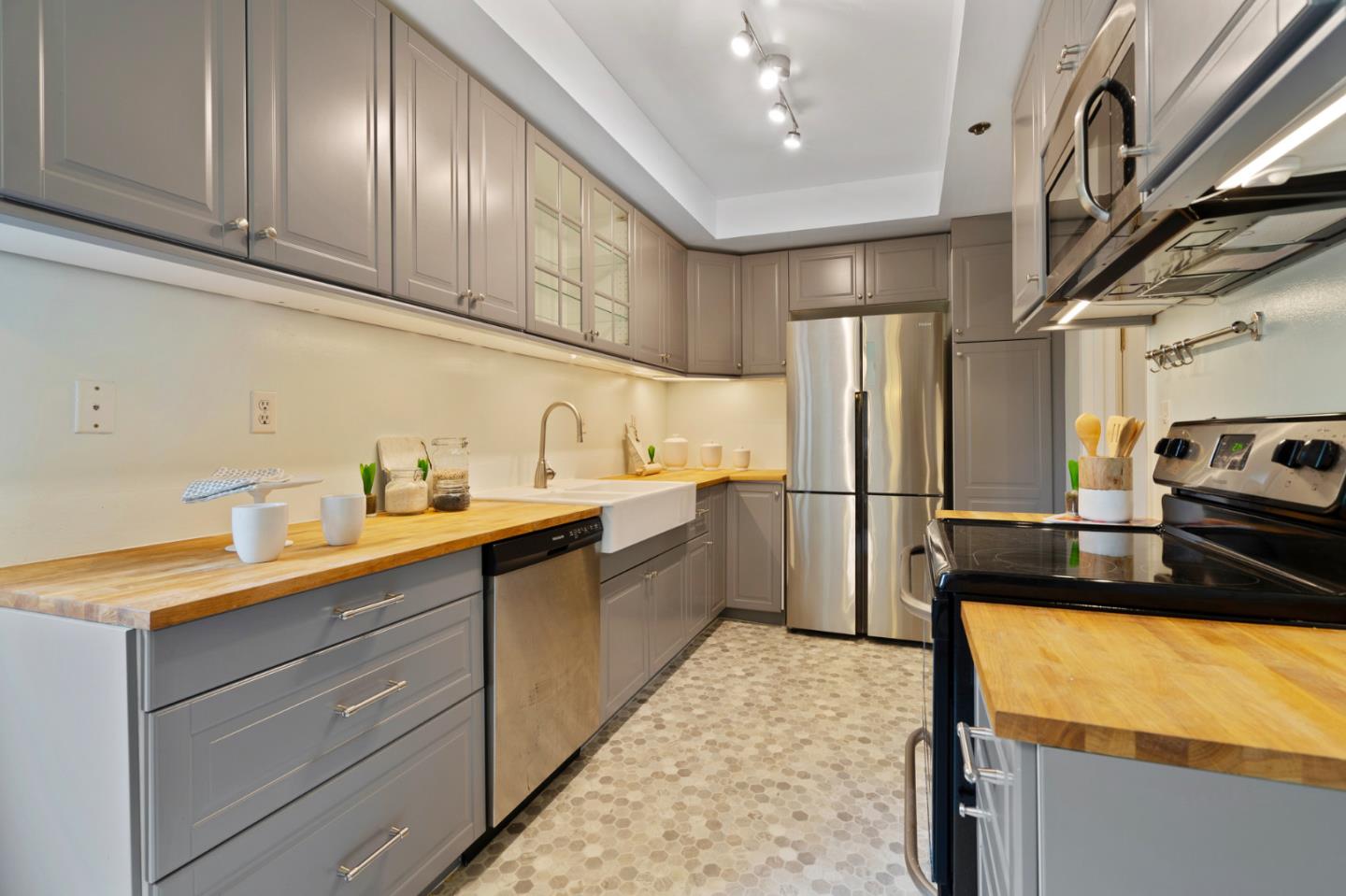 525 Almer Road, Unit 210 Burlingame, CA 94010 - Photo 4 of 36 a kitchen with granite countertop stainless steel appliances and counter space