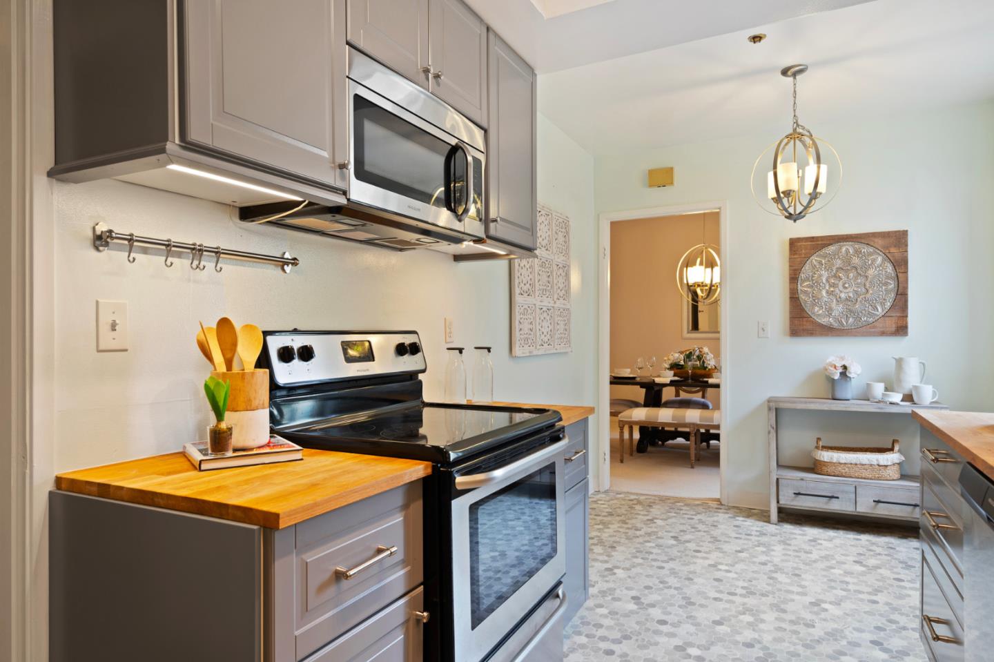 525 Almer Road, Unit 210 Burlingame, CA 94010 - Photo 5 of 36 a kitchen with stainless steel appliances granite countertop a stove and a sink
