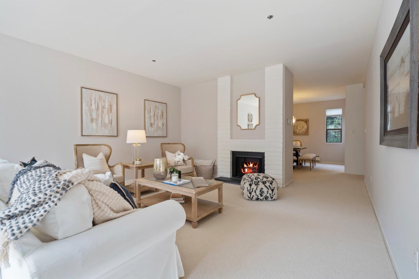 525 Almer Road, Unit 210 Burlingame, CA 94010 - Photo 10 of 36 a living room with furniture a clock and a fireplace