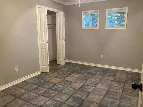 a view of an empty room and window