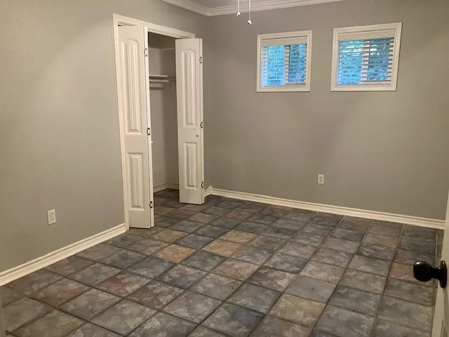 a view of an empty room and window