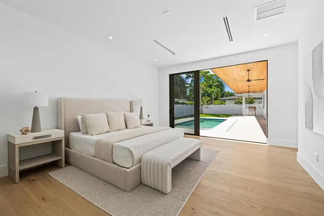 a bedroom with a large bed and a view of bedroom