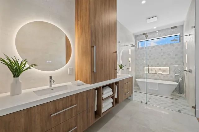 a bathroom with a double vanity sink and a mirror