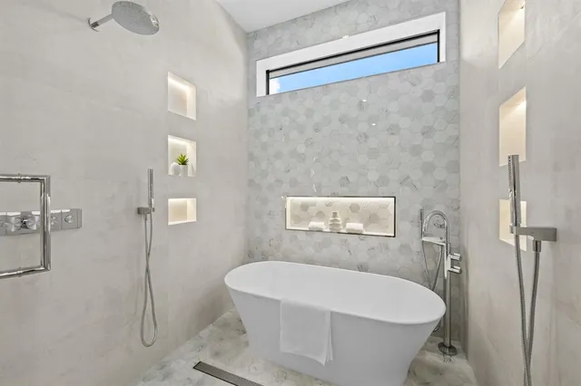 a white bath tub sitting in a bathroom