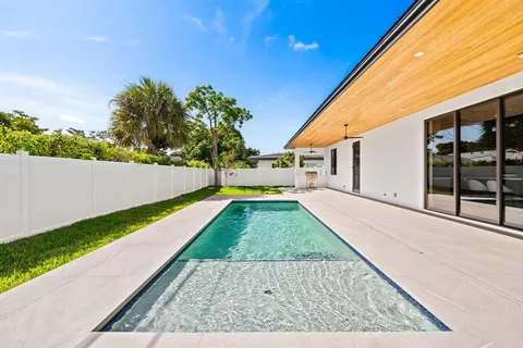 a view of backyard with large trees