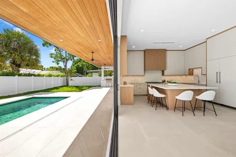 a view of a patio with table and chairs