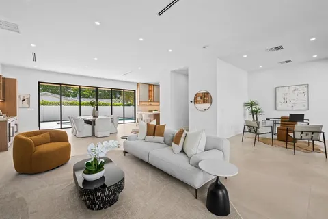 a living room with furniture and a lamp