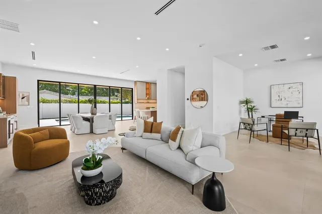 a living room with furniture and a lamp