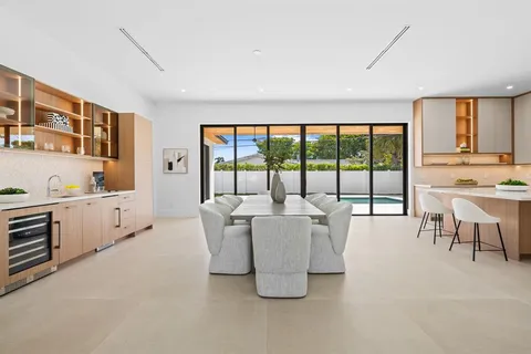 a living room with kitchen island furniture and a large window