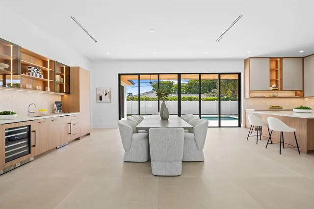 a living room with kitchen island furniture and a large window