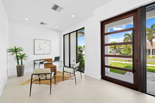 a workspace with furniture and a potted plant