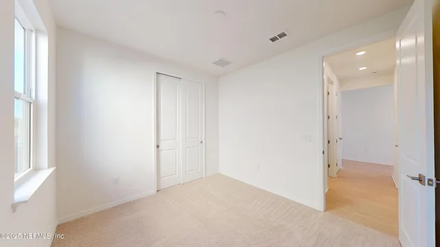 a kitchen with a sink a counter top space and windows