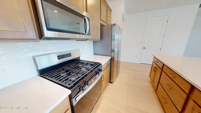 a kitchen with a sink and a window