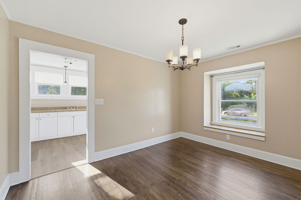 7604 Highway 252 Honea Path, SC 29654 - Photo 12 of 33 This versatile room features hardwood floors and a charming chandelier, perfect for various uses.