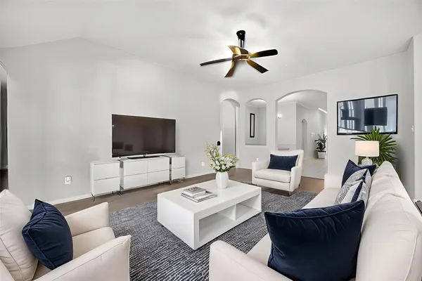a living room with furniture and a flat screen tv
