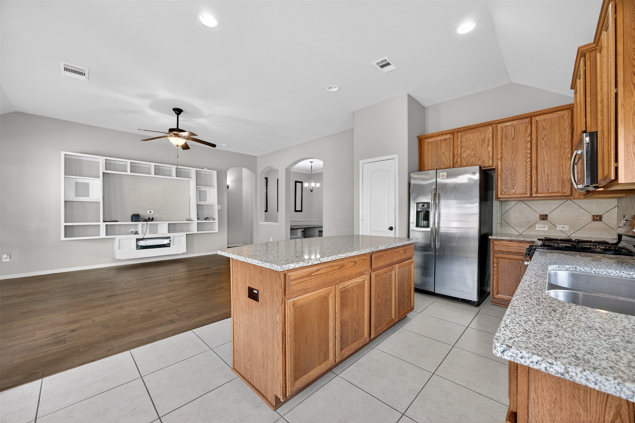 2009 Scissor Tail Road Pearland, TX 77581 - Photo 18 of 41 a kitchen with a sink stove and refrigerator