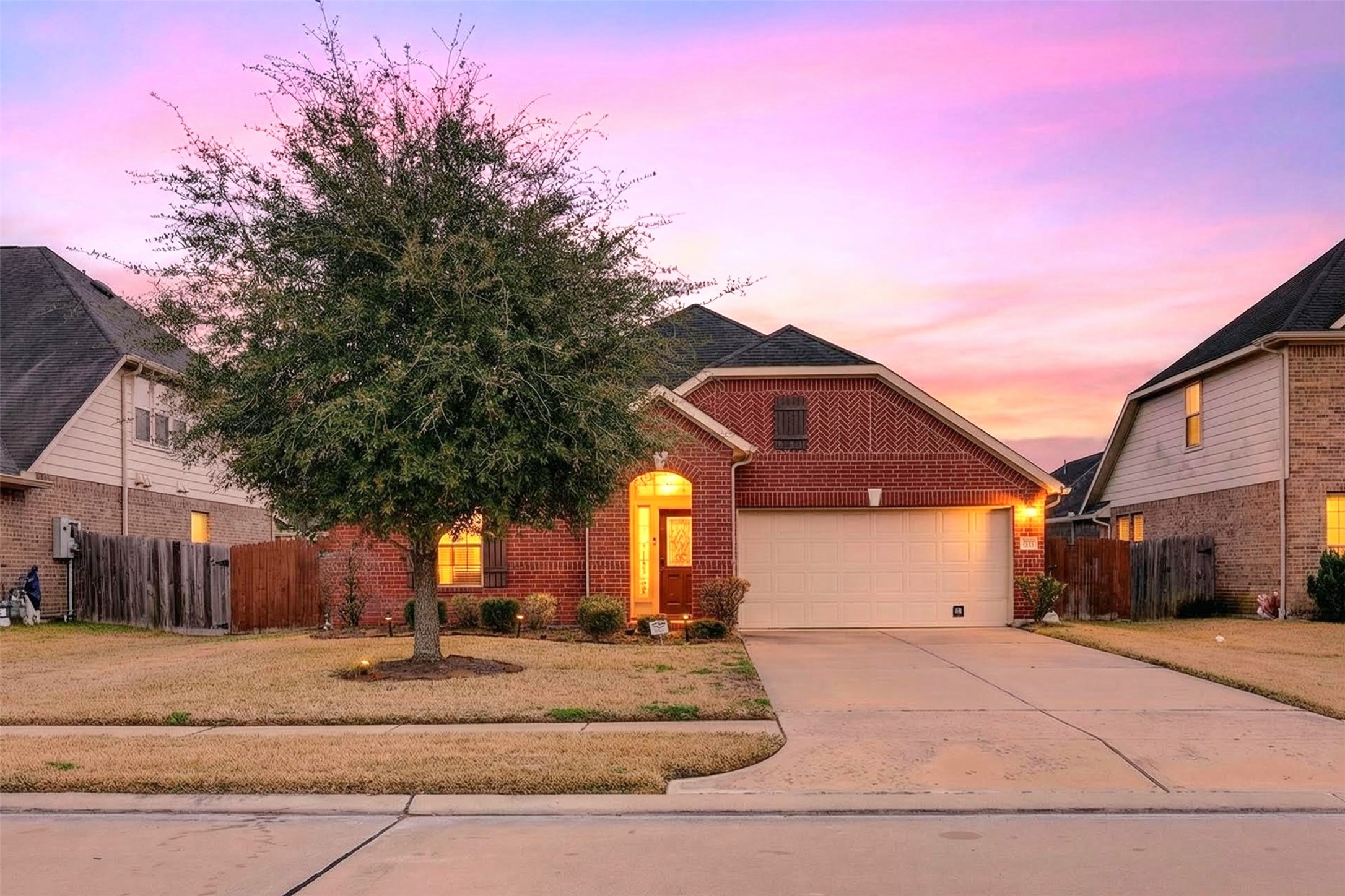 2009 Scissor Tail Road Pearland, TX 77581 - Photo 2 of 41 a front view of a house with a yard