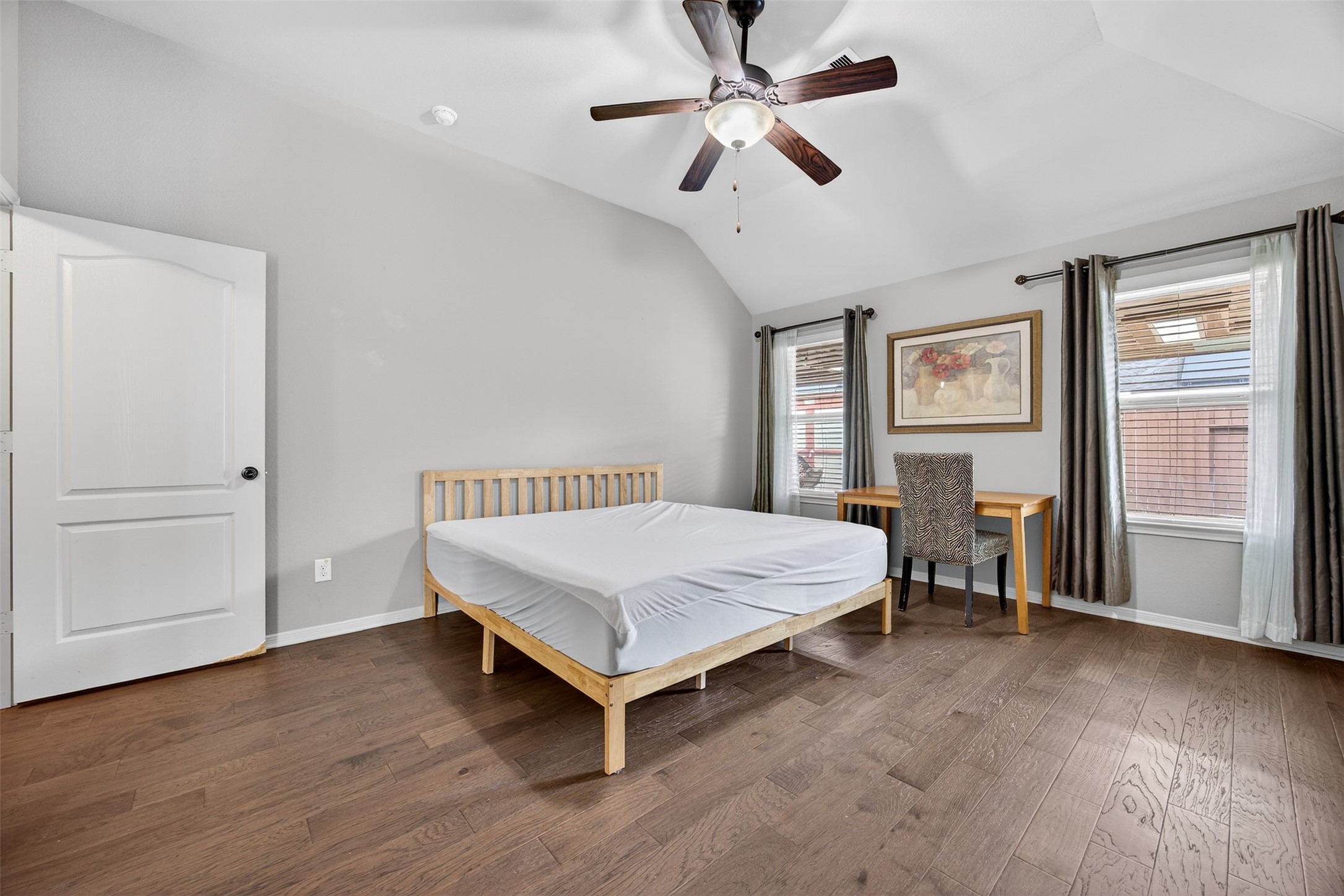 2009 Scissor Tail Road Pearland, TX 77581 - Photo 23 of 41 a bedroom with a bed and a chandelier