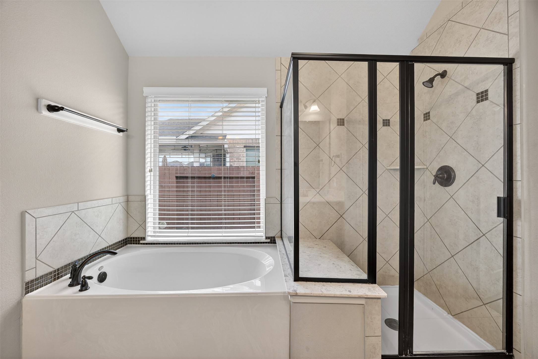 2009 Scissor Tail Road Pearland, TX 77581 - Photo 27 of 41 a bathroom with a bathtub and shower