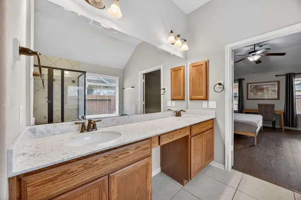 a bathroom with a sink double vanity and a mirror