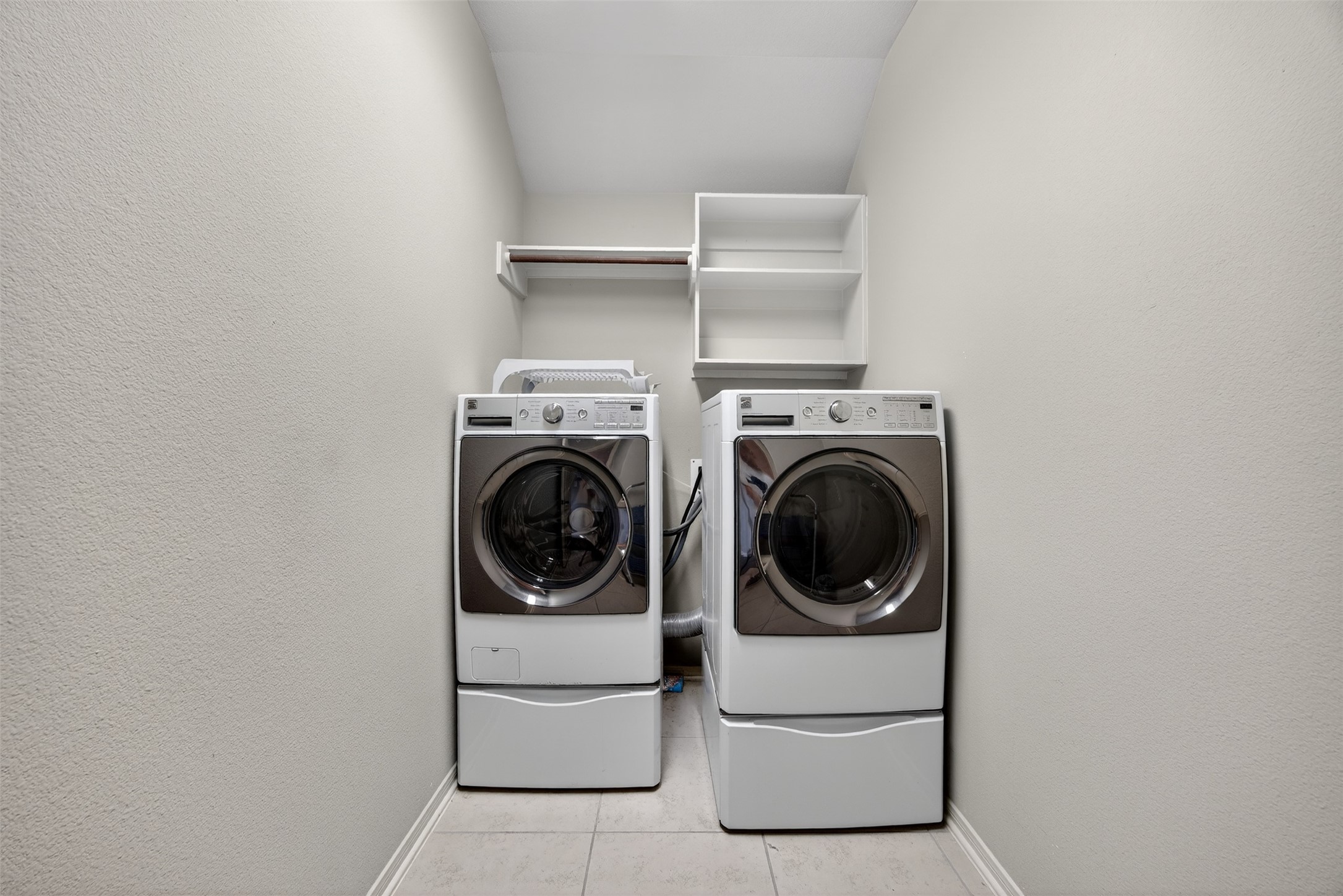 2009 Scissor Tail Road Pearland, TX 77581 - Photo 32 of 41 a utility room with dryer and washer