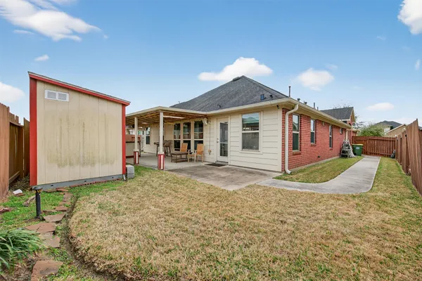 a view of a back yard of the house