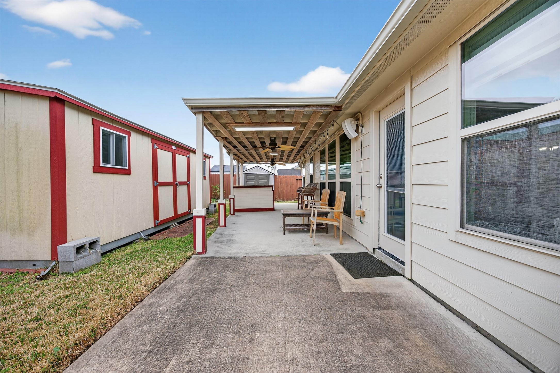 2009 Scissor Tail Road Pearland, TX 77581 - Photo 39 of 41 a view of a house with porch and wooden fence
