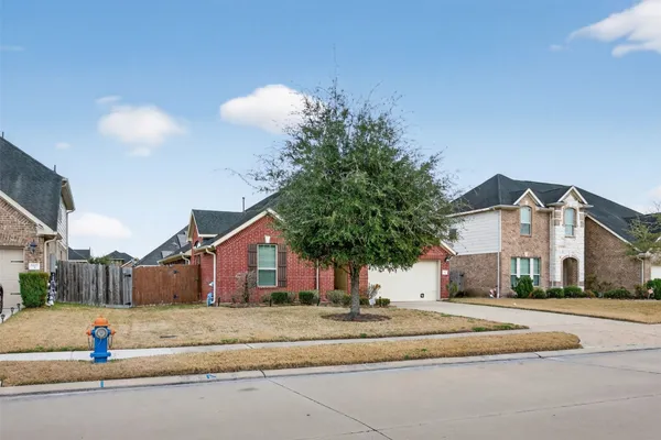 a view of street along with house and trees