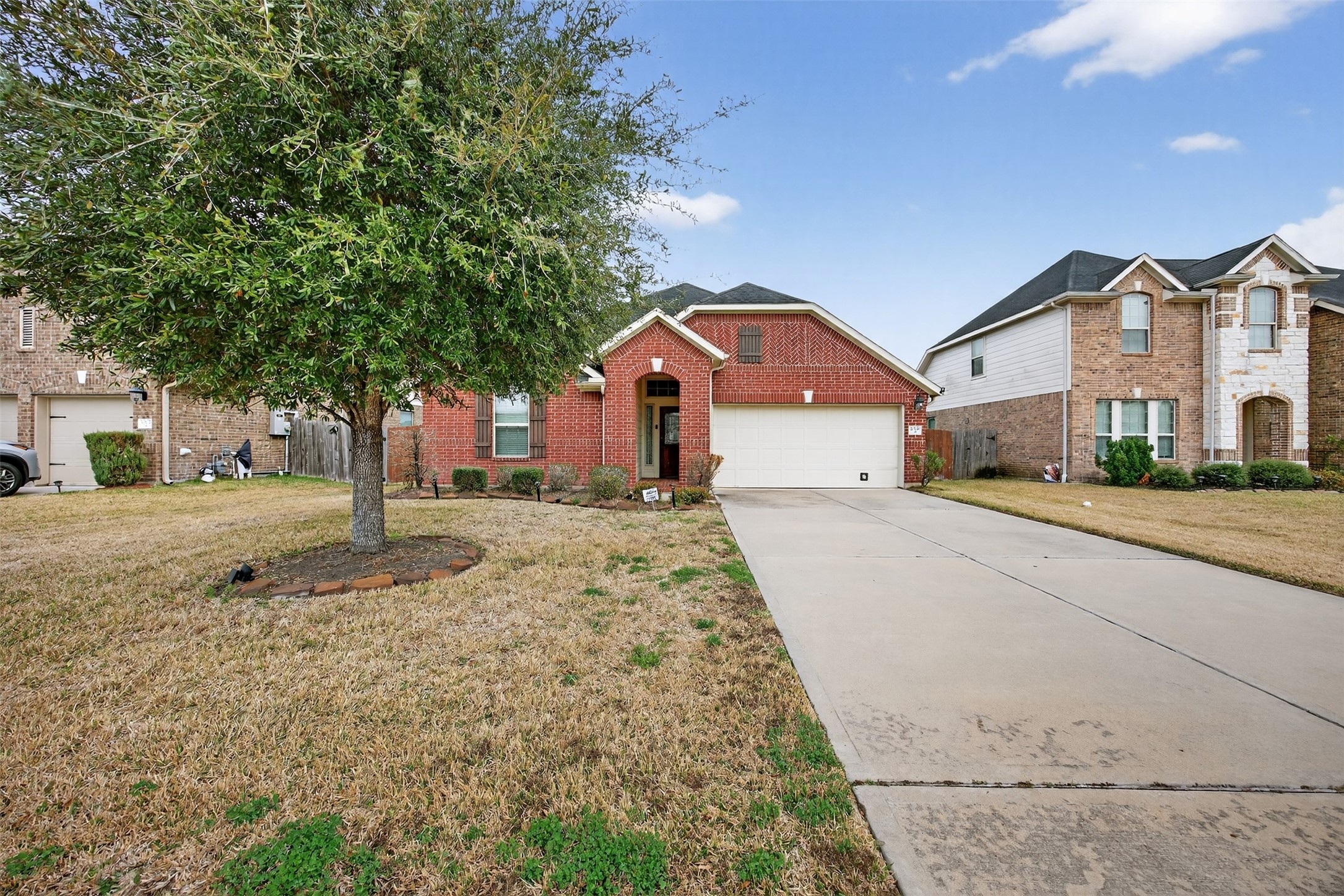 2009 Scissor Tail Road Pearland, TX 77581 - Photo 6 of 41 a front view of a house with a yard