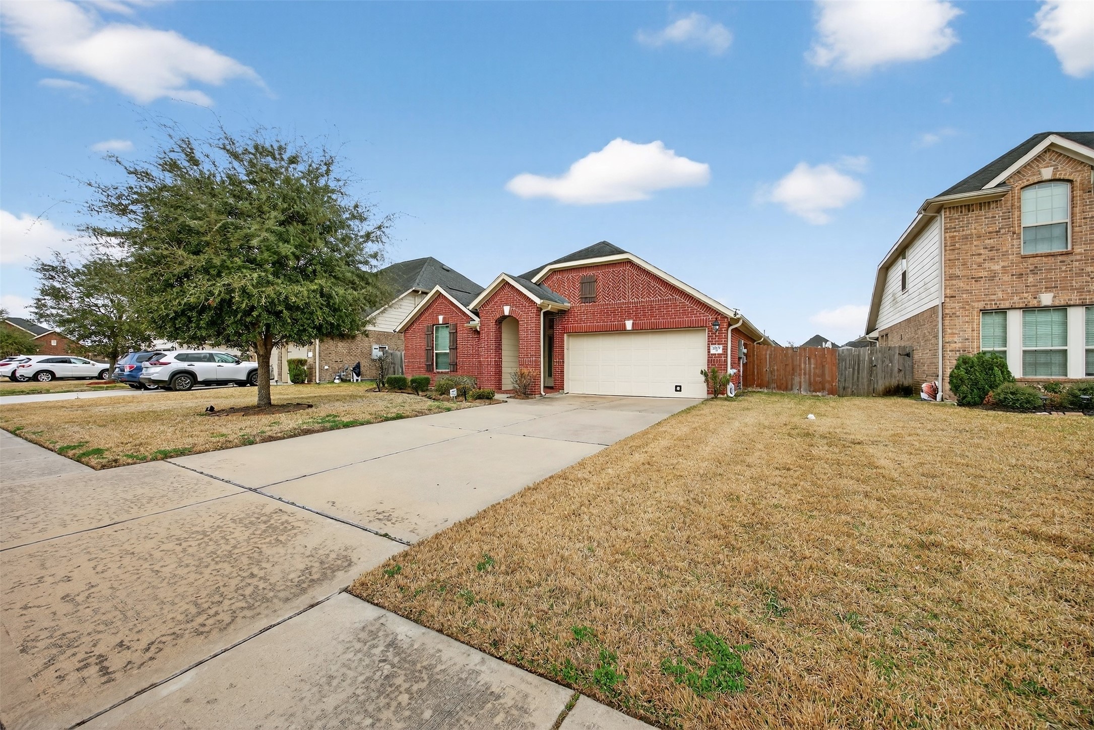 2009 Scissor Tail Road Pearland, TX 77581 - Photo 7 of 41 a front view of a house with a yard