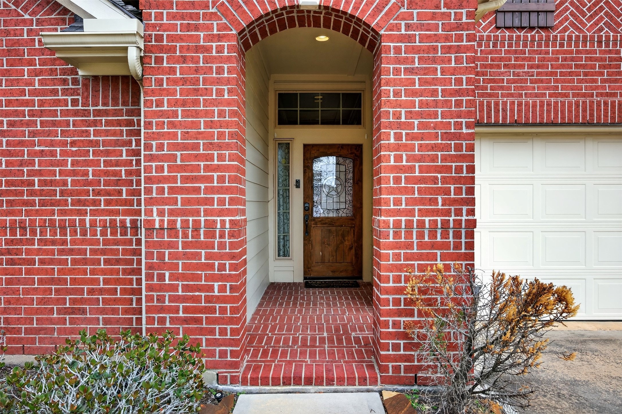 2009 Scissor Tail Road Pearland, TX 77581 - Photo 8 of 41 a front view of a house with a door